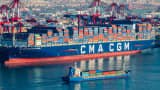 A cargo ship loaded with containers berths at Qingdao port in eastern China's Shandong province on Dec. 4, 2024.